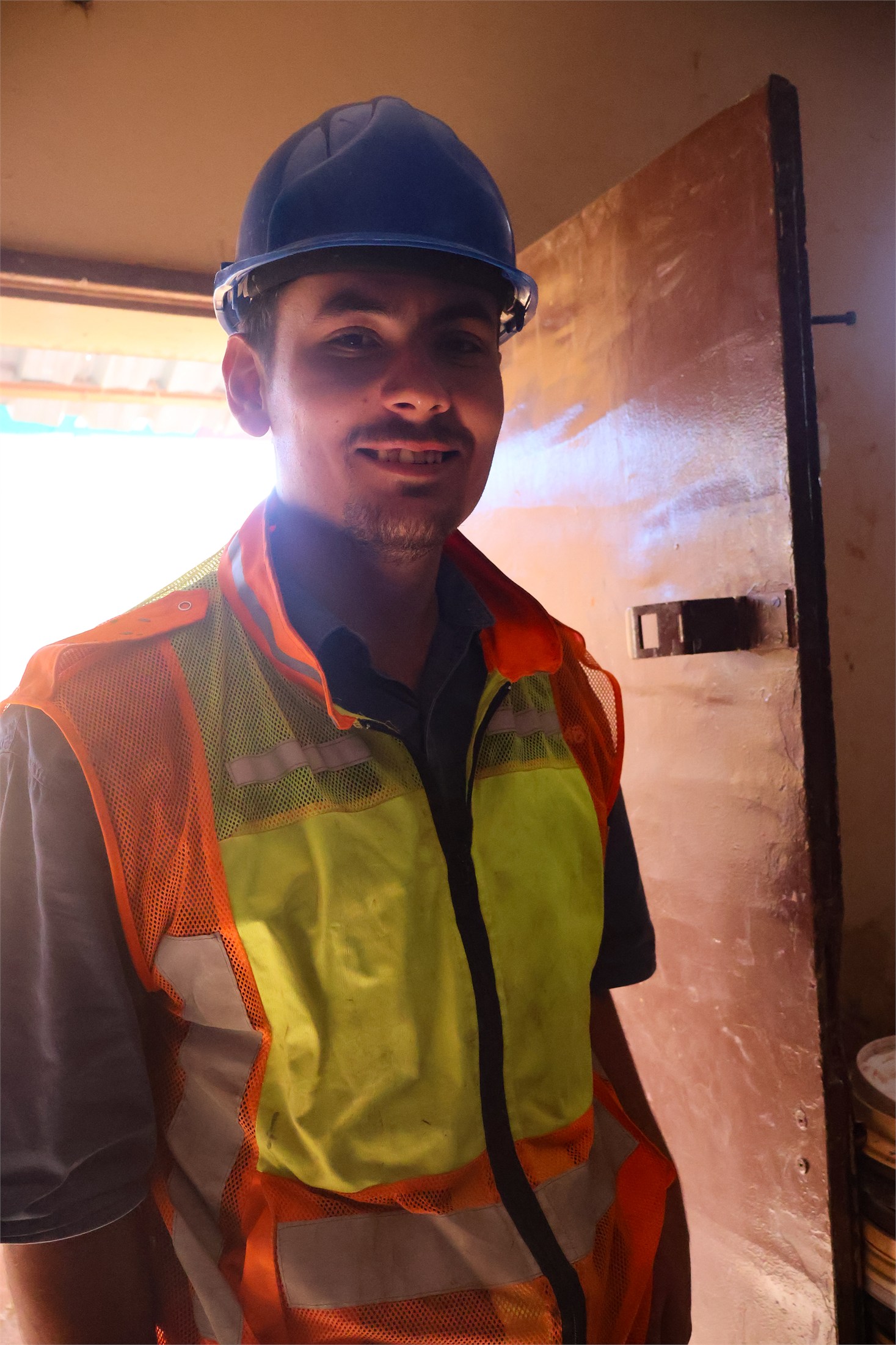 Stratalab technician in site safety gear inside the laboratory