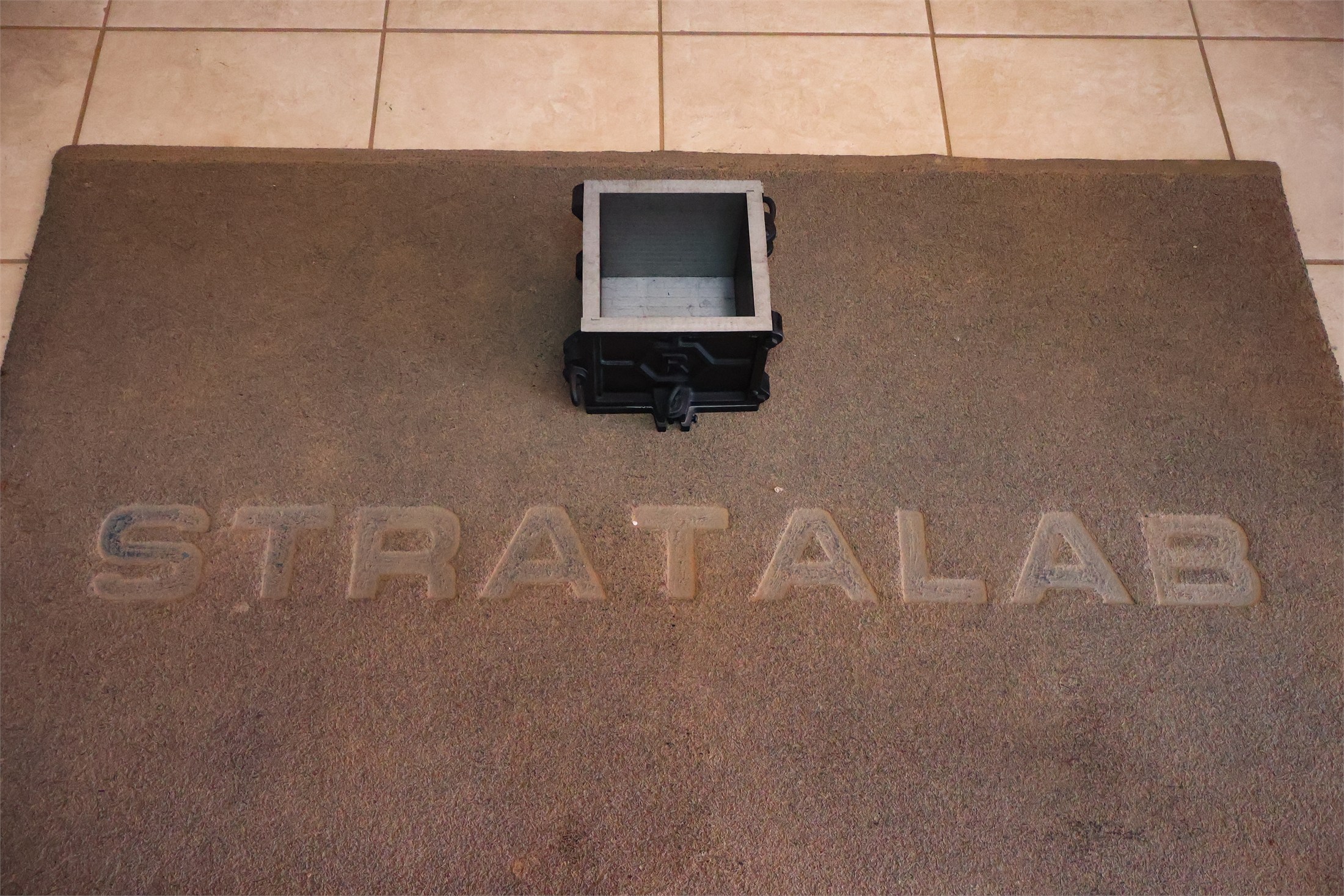 Stratalab branded sand display with a testing mould